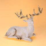 Renna seduta • H 38,7 cm