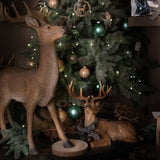 Renna Seduta con Fiocco e Campane  • 34,5 cm