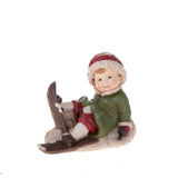 Bimbo Seduto con Sci  • 12,5 cm