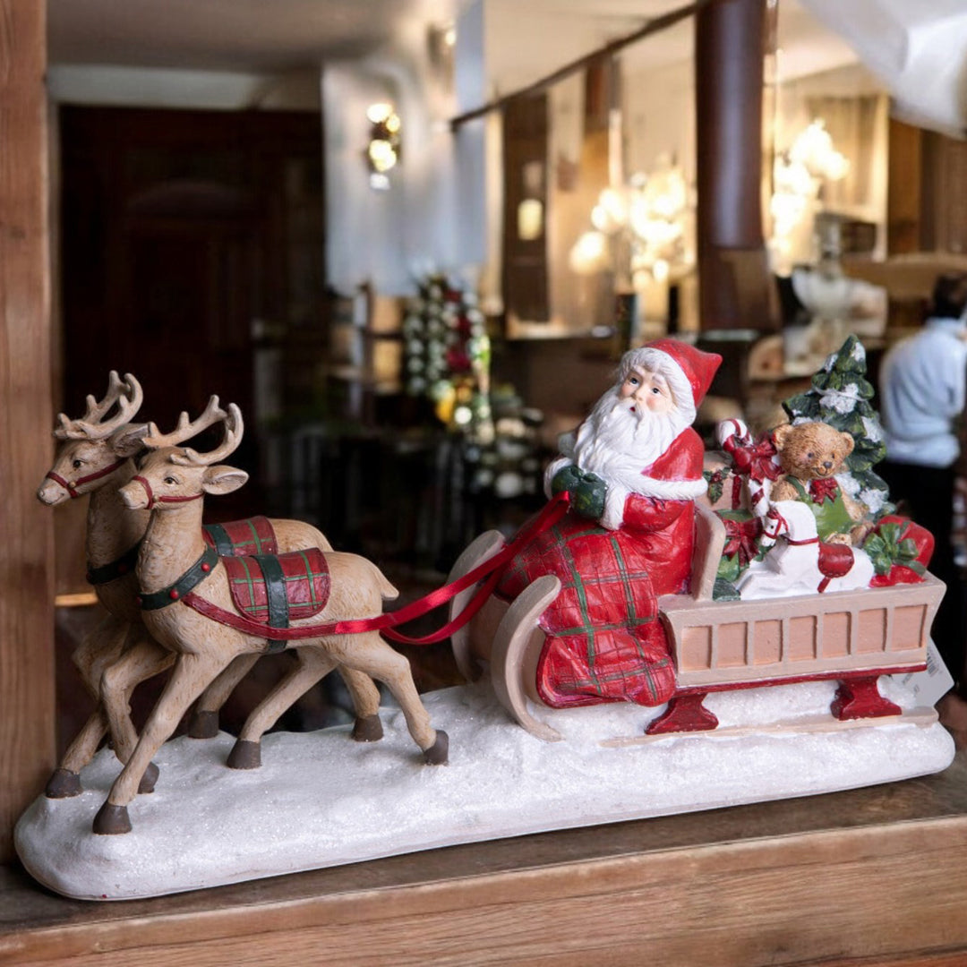 Babbo natale su slitta con daini • H 18,6 cm
