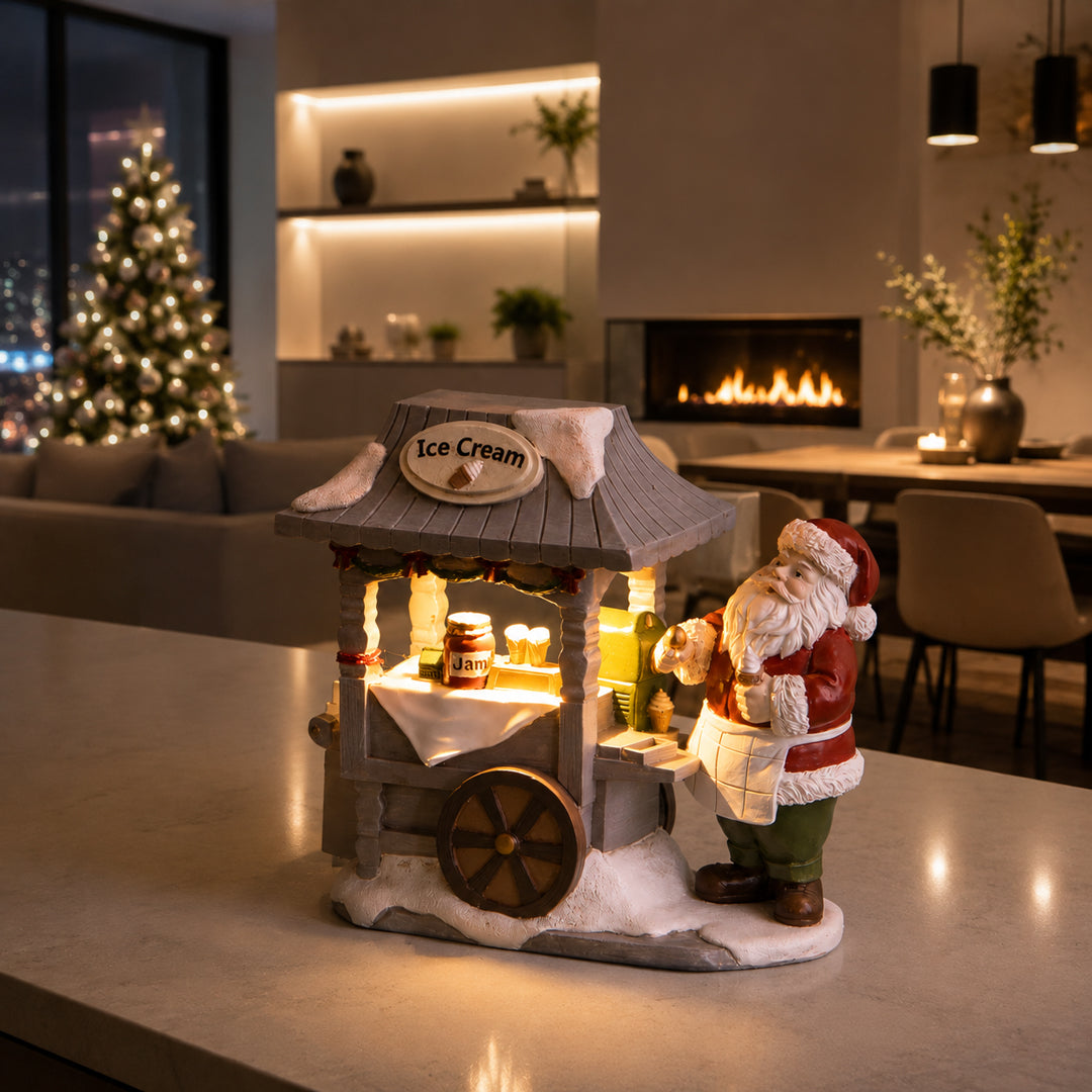 Babbo nat.con carretto dolci con led • H 14 cm
