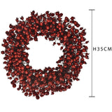 Corona con bacche rosse • H 9 cm