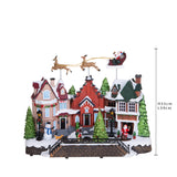 Villaggio con slitta movimento+luci+musica • H 33 cm