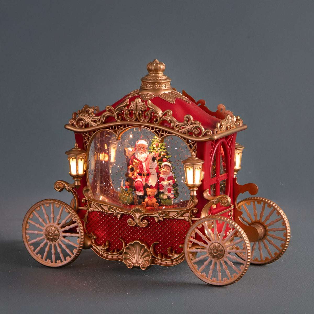 Carrozza 25.5xh21 cm con santa led+musica • H 21 cm